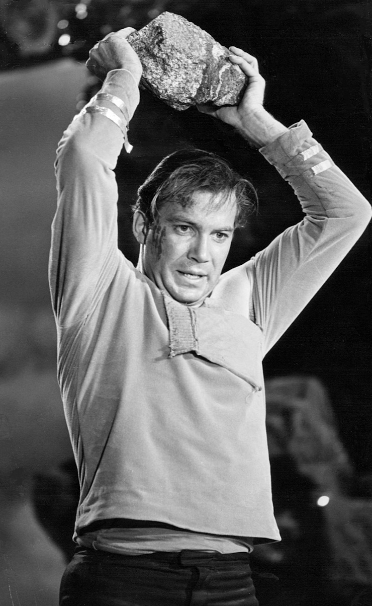 Captain Kirk about to throw a rock