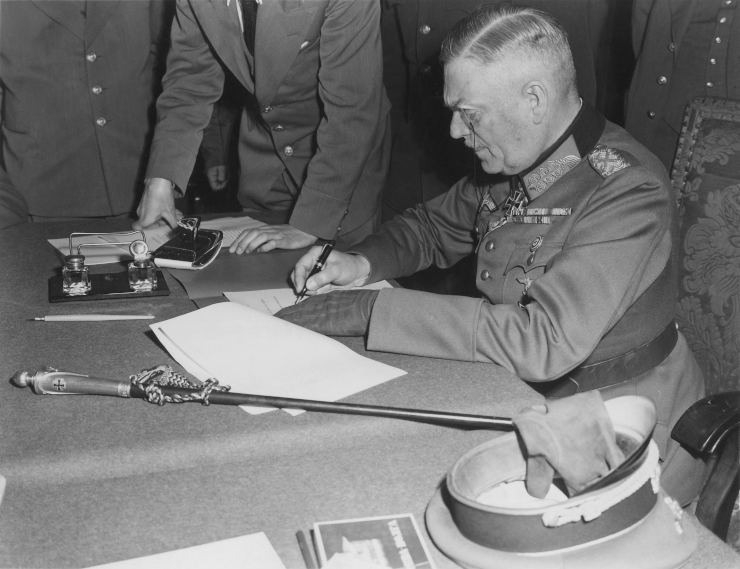 Field Marshall Wilhelm Keitel, signing the ratified surrender terms for the German Army at Russian Headquarters in Berlin. Germany, May 7, 1945